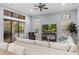 Bright living room with high ceilings, modern decor, and access to the outdoor area at 3123 Bentonshire Pl, Longwood, FL 32779