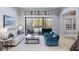 Elegant living room features a wall of sliding glass doors leading to the pool area at 3123 Bentonshire Pl, Longwood, FL 32779