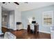 Well-lit office with hardwood floors, computer desk, and a calming color scheme at 3123 Bentonshire Pl, Longwood, FL 32779