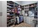 Spacious walk-in closet with custom shelving and storage solutions for clothing, shoes, and accessories at 3123 Bentonshire Pl, Longwood, FL 32779