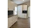 Bright kitchen with white cabinets, granite countertops and subway tile backsplash at 3224 Holland Dr, Orlando, FL 32825