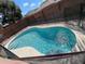 Sparkling private pool surrounded by a safety fence and wood fencing at 3224 Holland Dr, Orlando, FL 32825