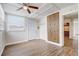 Bright bedroom featuring wood-look floors, built in storage and a ceiling fan at 34936 3Rd Ave, Leesburg, FL 34788