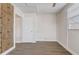 Bright bedroom featuring wood-look floors and built in storage at 34936 3Rd Ave, Leesburg, FL 34788