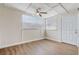 Bright bedroom featuring wood-look floors, natural light and a ceiling fan at 34936 3Rd Ave, Leesburg, FL 34788