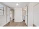 Neutral bedroom featuring two doors and wood-look flooring at 34936 3Rd Ave, Leesburg, FL 34788