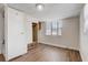 Bright bedroom featuring a built-in closet and bay window with blinds at 34936 3Rd Ave, Leesburg, FL 34788