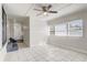 Open living room with tile floors, natural light, and neutral paint at 34936 3Rd Ave, Leesburg, FL 34788