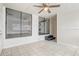 Comfortable living room with tile flooring, natural light, and entry to the kitchen at 34936 3Rd Ave, Leesburg, FL 34788