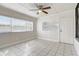 Bright and airy living room with tile flooring and a ceiling fan at 34936 3Rd Ave, Leesburg, FL 34788