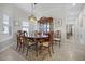 Dining room with decorative lighting and an elegant china cabinet, perfect for Gathering gatherings at 3543 Fairwaters Ct # D, Clermont, FL 34711