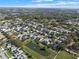 This aerial view of a residential area features lush greenery, scenic ponds, and well-maintained homes at 398 Lake Amberleigh Dr, Winter Garden, FL 34787