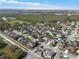 A scenic aerial shot captures a suburban neighborhood, framed by mature trees, showcasing the community's charm at 398 Lake Amberleigh Dr, Winter Garden, FL 34787