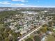 Expansive aerial view of a planned residential community featuring manicured landscaping and tree-lined streets at 398 Lake Amberleigh Dr, Winter Garden, FL 34787