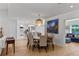 Open concept dining area offering hardwood floors and connecting to multiple living spaces at 420 Sylvan Dr, Winter Park, FL 32789