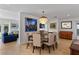 Formal dining room showcasing a decorative chandelier and an adjacent living space at 420 Sylvan Dr, Winter Park, FL 32789