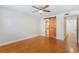 Bedroom featuring hardwood floors, ceiling fan, neutral paint and stylish barn door at 4212 Lake Underhill Rd # 5, Orlando, FL 32803