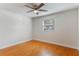 Bedroom with wood floors, ceiling fan, and a window that provides plenty of natural light at 4212 Lake Underhill Rd # 5, Orlando, FL 32803