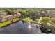 Beautiful aerial view of the community featuring a scenic pond with fountains, and lush trees, perfect for outdoor enjoyment at 4367 Thornbriar Ln # P204, Orlando, FL 32822