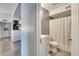 Hallway view of a modern bathroom featuring a shower-tub combo and a sink with white cabinet at 4367 Thornbriar Ln # P204, Orlando, FL 32822