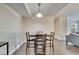 Inviting dining room featuring dark wood floors and a simple light fixture over the table at 4367 Thornbriar Ln # P204, Orlando, FL 32822