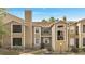 Charming condo with tan siding, brick accents, and cozy balconies under a bright blue sky at 4367 Thornbriar Ln # P204, Orlando, FL 32822