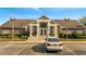 Community clubhouse exterior with well-manicured landscaping, ample parking, and welcoming entrance at 4367 Thornbriar Ln # P204, Orlando, FL 32822