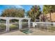 Outdoor hot tub with white pergola set amongst trees and landscaping at 4367 Thornbriar Ln # P204, Orlando, FL 32822