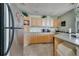 Bright kitchen featuring stainless steel appliances, light wood cabinets and tile flooring at 4367 Thornbriar Ln # P204, Orlando, FL 32822