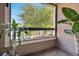 Cozy patio space with tiled flooring and lush greenery offering a serene outdoor experience at 4367 Thornbriar Ln # P204, Orlando, FL 32822