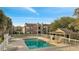 Community swimming pool next to apartment buildings with a large lawn and lounge chairs at 4367 Thornbriar Ln # P204, Orlando, FL 32822