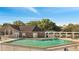 A swimming pool surrounded by a building and lush trees on a bright sunny day at 4367 Thornbriar Ln # P204, Orlando, FL 32822