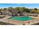 Community swimming pool with clear blue water, surrounded by trees and blue skies at 4367 Thornbriar Ln # P204, Orlando, FL 32822