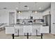 Stylish kitchen island featuring granite countertops, seating, and pendant lighting at 4426 Davos Dr, Clermont, FL 34711