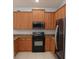 Kitchen featuring wooden cabinets, stainless steel appliances, and granite countertops, ready for cooking and entertaining at 4650 Redmond Pl, Sanford, FL 32771