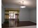 Bright living room featuring hard wood flooring, a ceiling fan and decorative curtains at 4650 Redmond Pl, Sanford, FL 32771