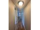 Inviting hallway with wood floors leading to the front door and other rooms of the home at 4822 Conway Rd # 125, Orlando, FL 32812