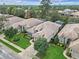 This aerial view shows a well-maintained home with mature landscaping in a desirable residential neighborhood at 501 Sotheby Way, Debary, FL 32713