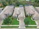 An aerial view shows a well-maintained home with mature landscaping in a desirable residential neighborhood at 501 Sotheby Way, Debary, FL 32713