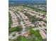 Aerial view of a residential neighborhood featuring well-maintained homes, trees, and a golf course at 501 Sotheby Way, Debary, FL 32713