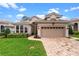 Charming home featuring a manicured lawn and a two-car garage, perfect for suburban living at 501 Sotheby Way, Debary, FL 32713