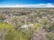 Overhead shot highlighting the home's location within a lush, tree-filled community at 607 Powers Ave, Port Orange, FL 32127