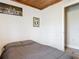 Bedroom with bed features wood ceiling and wood-look floors at 607 Powers Ave, Port Orange, FL 32127