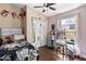 Well-lit bedroom with closet, desk, and wood look floors at 618 Minnesota Ave, St Cloud, FL 34769