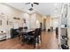 Spacious dining area with dark wood floors, stylish decor, and an adjacent living space at 618 Minnesota Ave, St Cloud, FL 34769