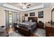 Serene main bedroom with tray ceiling, decorative elements, and direct access to the backyard at 618 Minnesota Ave, St Cloud, FL 34769