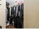 Large walk-in closet with double hanging racks, shelves, and hardwood floors at 618 Minnesota Ave, St Cloud, FL 34769