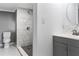 Updated bathroom features a marble tiled shower, grey vanity and modern fixtures at 630 N Nashua Ave, Fort Meade, FL 33841