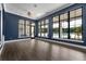 Yoga room with a view of the pool area and neighborhood landscape through expansive windows at 7071 Painted Bunting Way, St Cloud, FL 34773