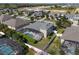 Aerial view of a property featuring a screened-in pool, lush lawn and a white fence at 713 Duff Dr, Winter Garden, FL 34787